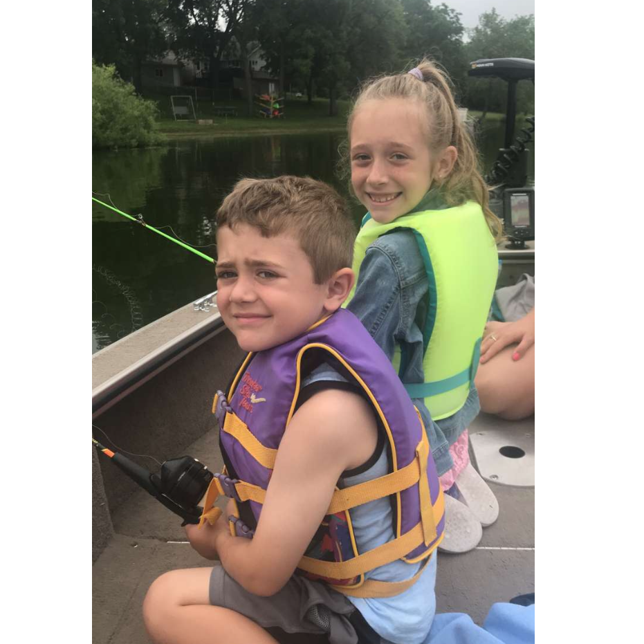 Ash and Alex fishing on the boat