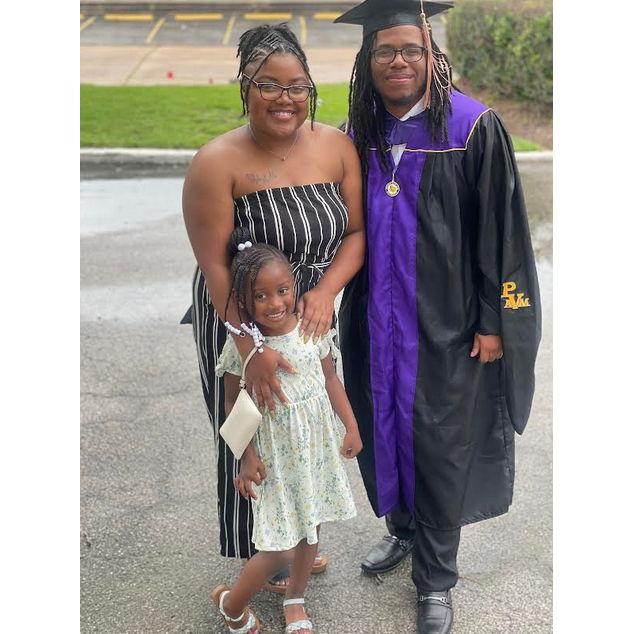 This photo was taken on the day, Malcolm obtained his Masters degree in Business Administration from Prairie View A&M University.