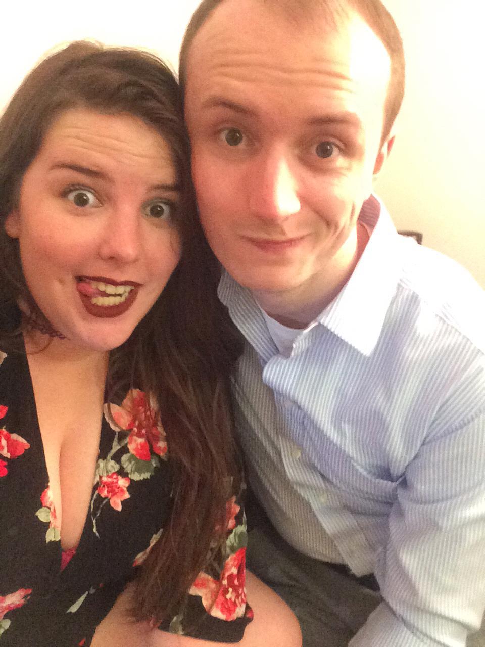 The faces of two college graduates, having survived 4 years of long distance!