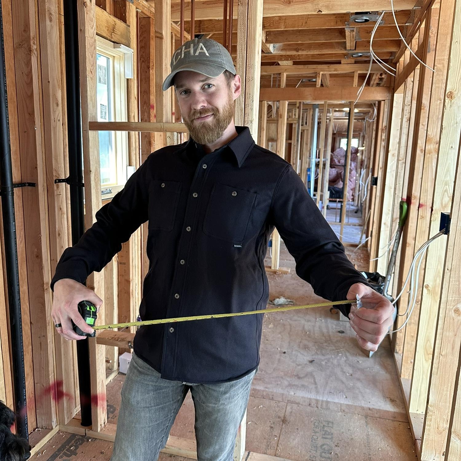 We lived in a little trailer while we went through an extensive home remodel for over a year and a half. Photo from December 2024, when our house was down to the studs. Lots of studs in the picture.