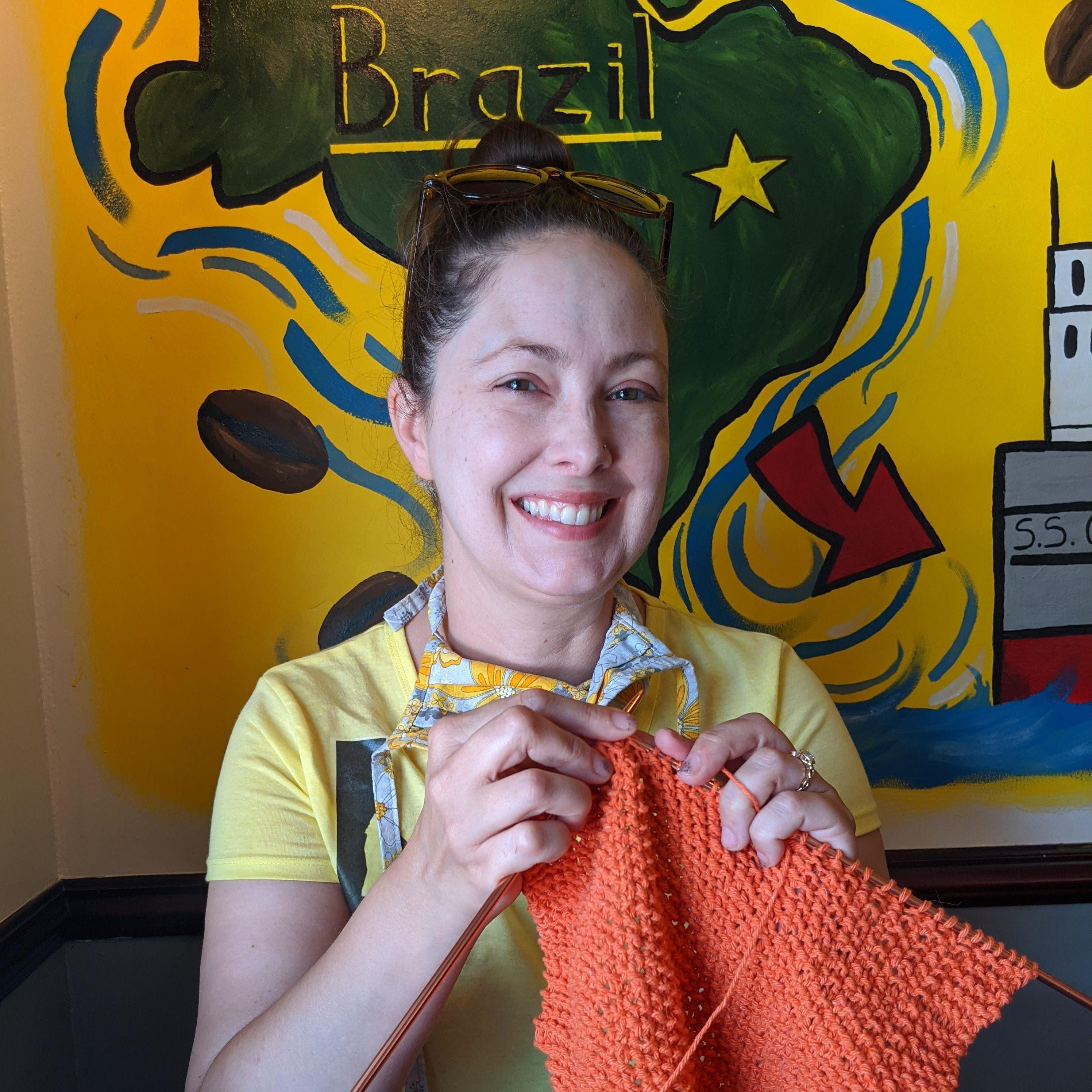 Laraine in her element. In a coffee shop and knitting.