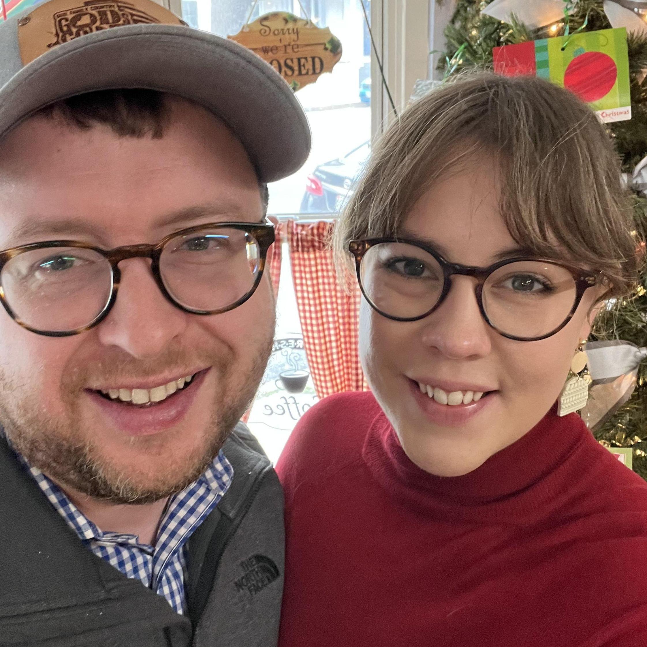 When she insists you take a picture in front of the Christmas tree in a window of a small diner, you do it.