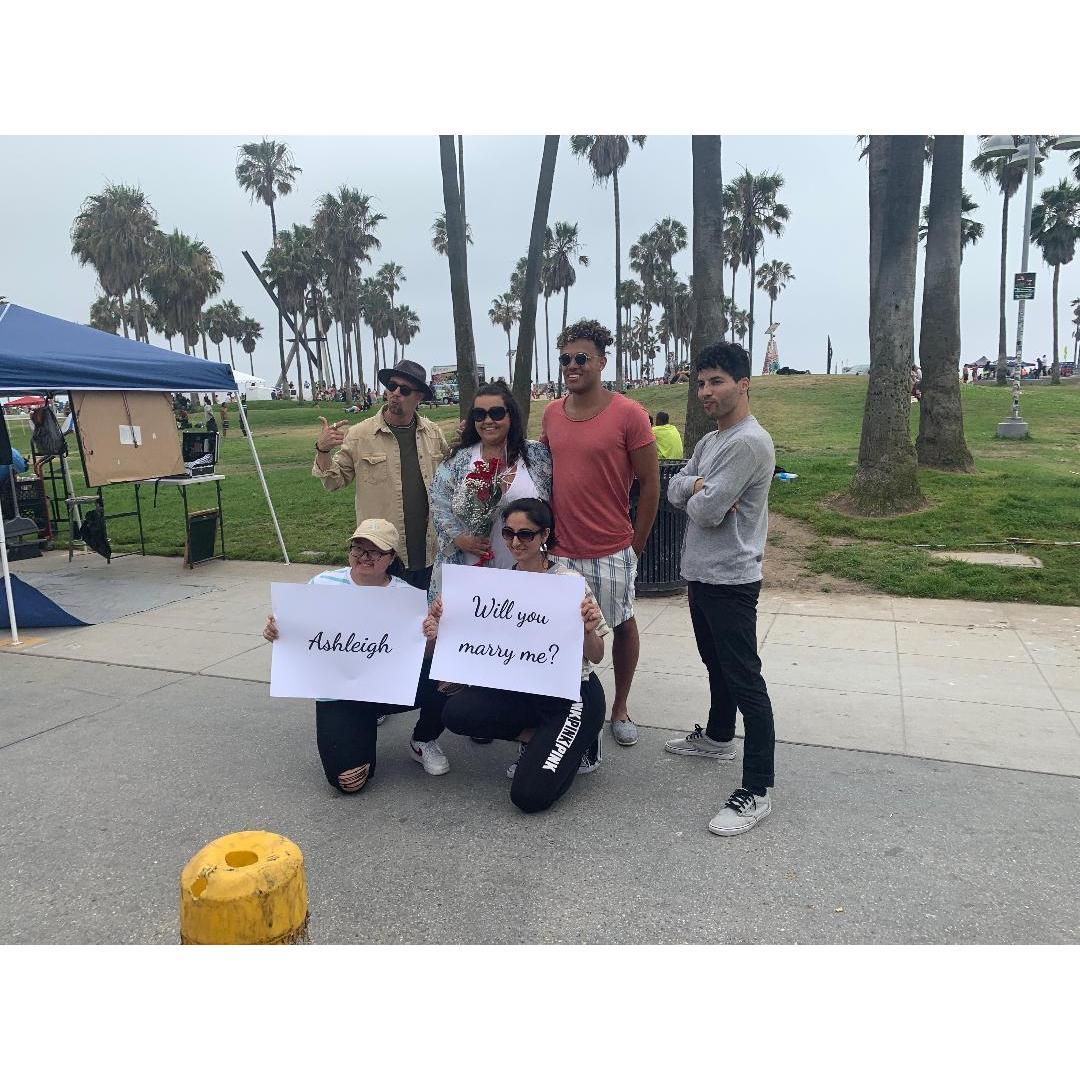 Tevin hired break dancers to perform in Venice Beach, California when he proposed. They made me go in the middle, put a blanket over my head because they were going to "jump over me" ;)