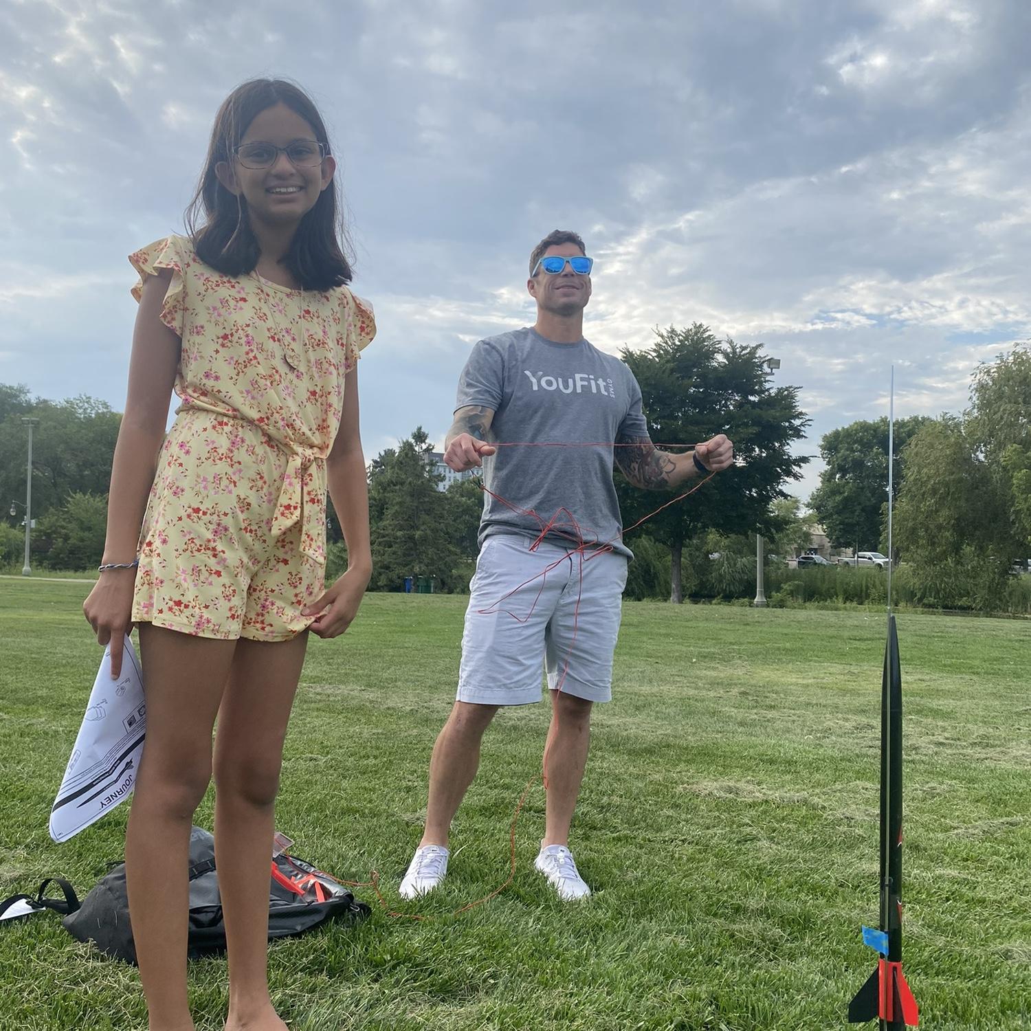 Casey launching rockets with Sarah.