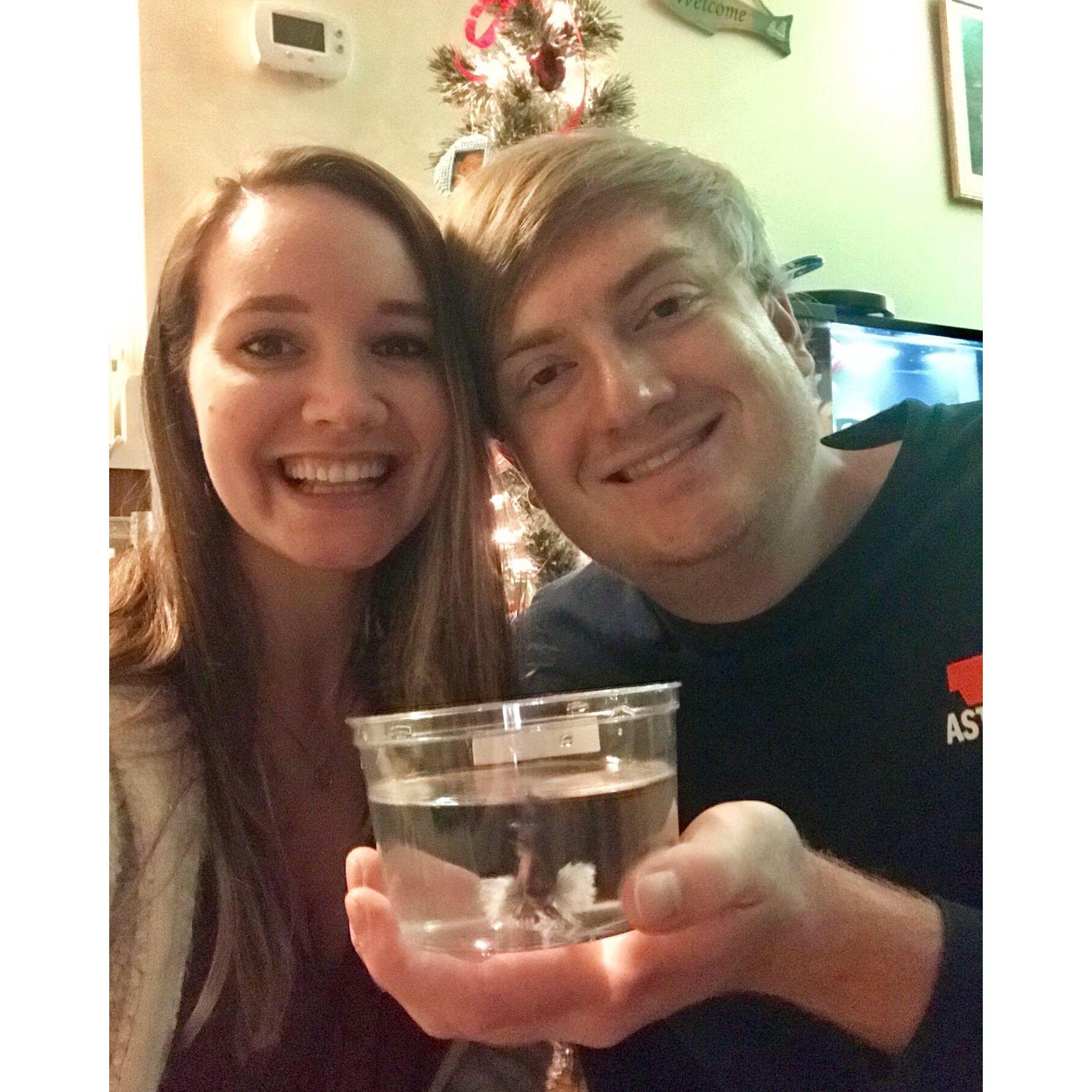 Family Christmas card! Addie, Jake, and their betta fish, Spica, at their first apartment together, where they also got engaged.