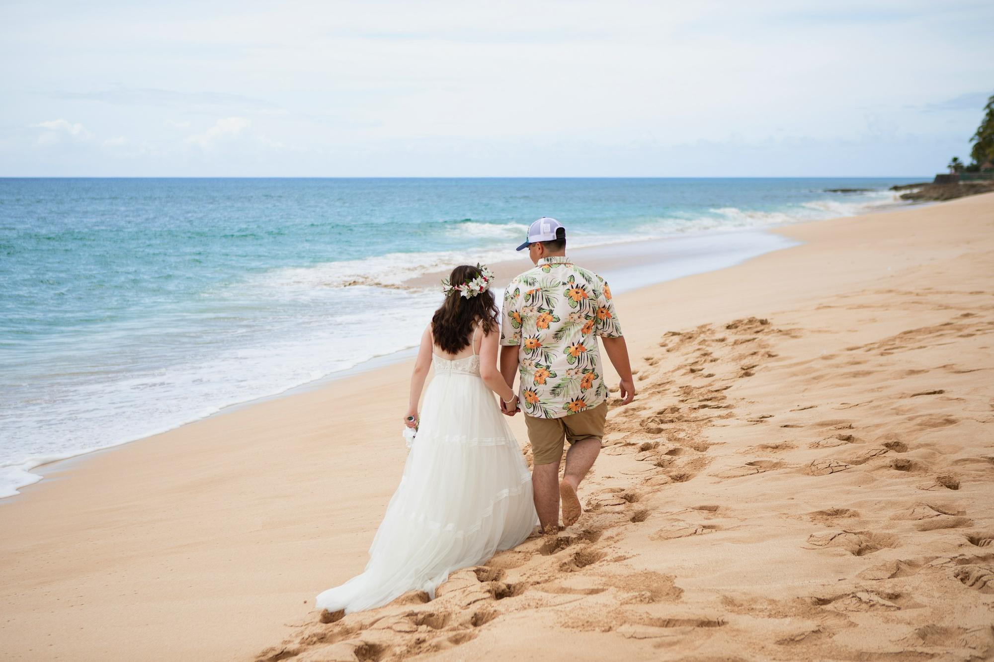 A quick walk on the beach in Makaha, Hawaii after being officially married 2021