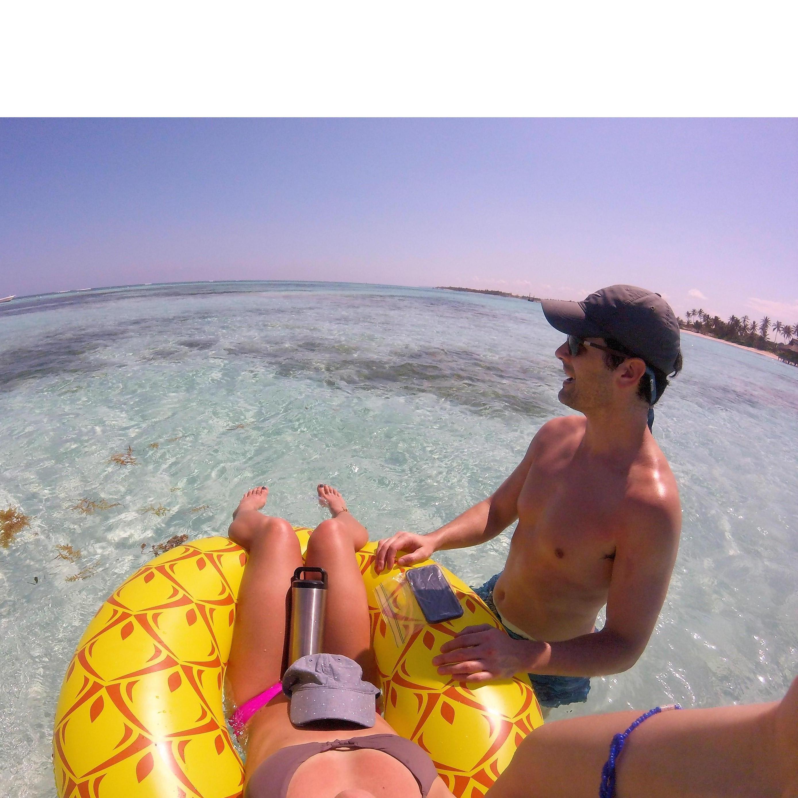 Steven taking in the crystal clear water as Jill lounges on her pineapple float. Punta Cana, April 2017.