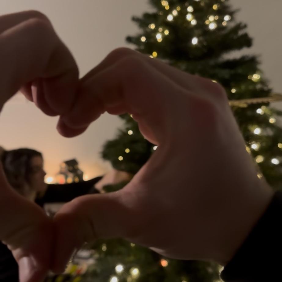 First Christmas together, any chance this man gets he makes hearts with his hands in our photos. You will soon see the pattern💕 -