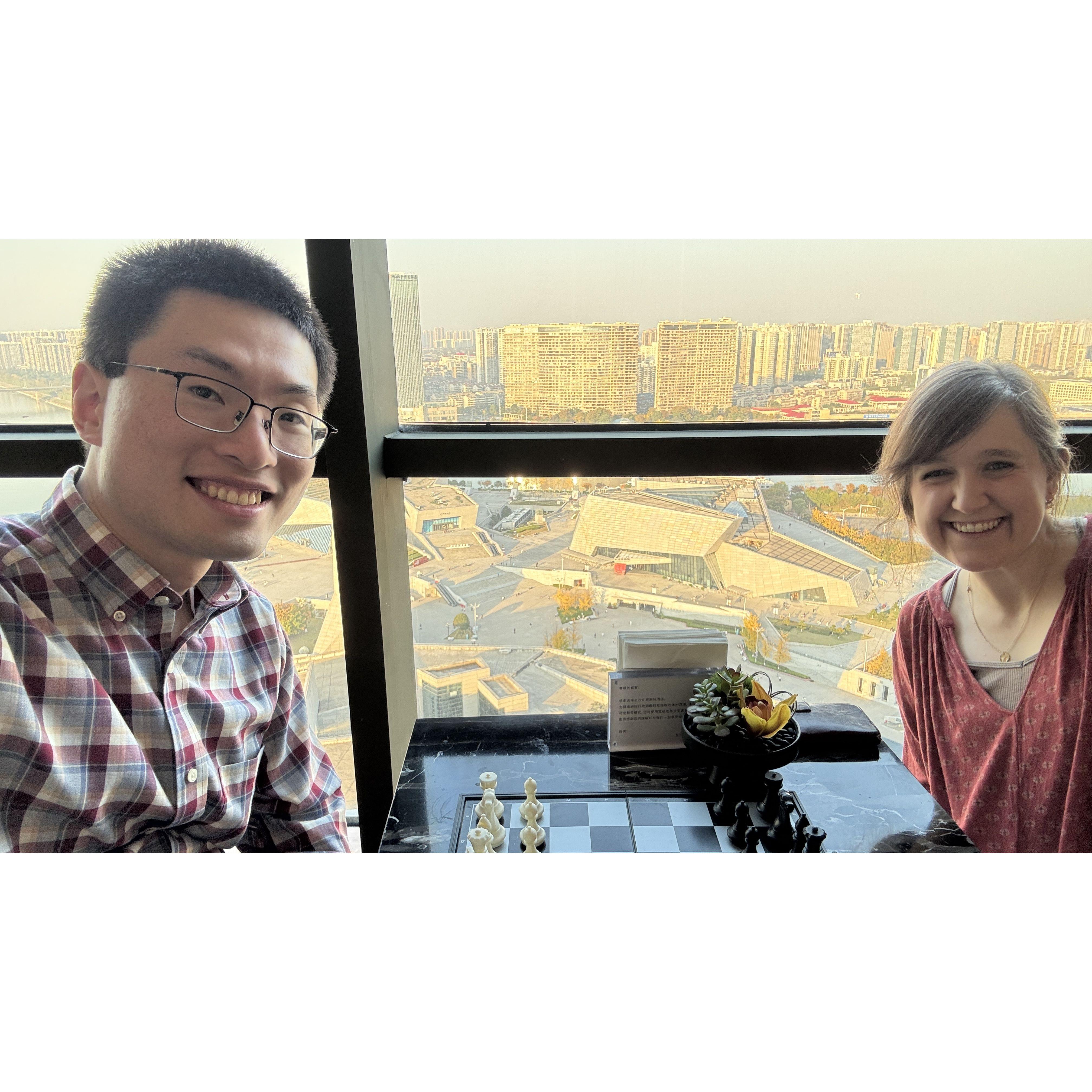 Our first game of chess, looking out on the city