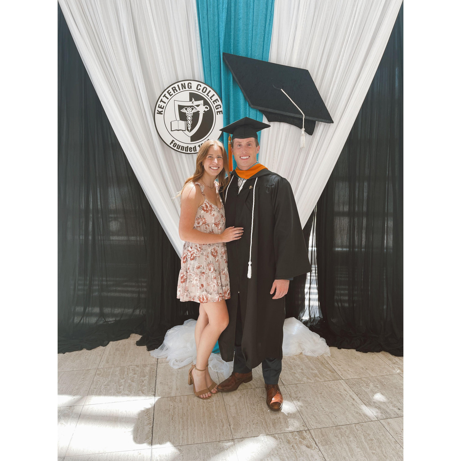 Us at John's nursing school graduation, July 2023