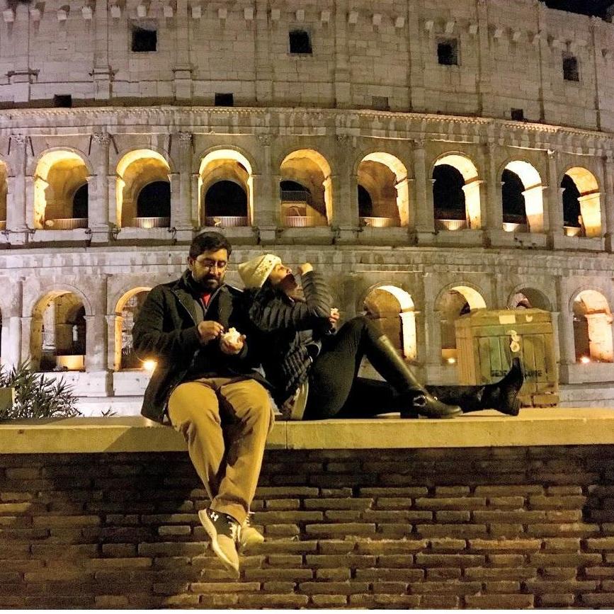 One of the couple's favorite activities on vacation is sleeping in and taking long, agenda-less nighttime walks. This particular evening's walk led to gelato outside the Colosseum in Rome.