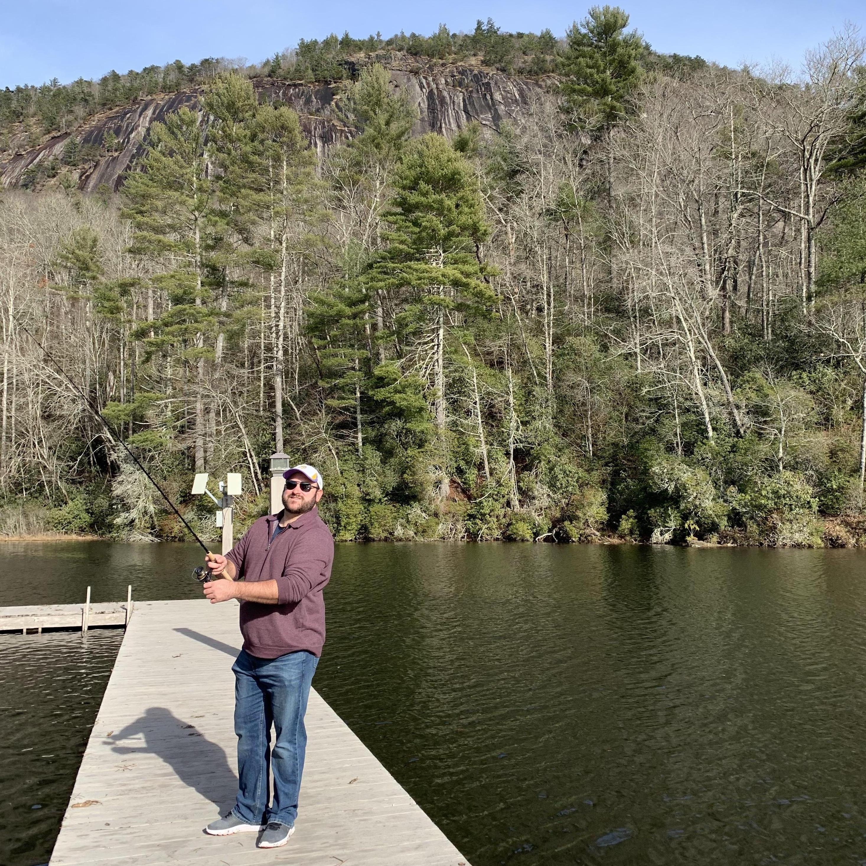 Jared fishing off the dock of Camp Merrie Woode in Sapphire, NC - where Emily was a camp counselor in 2011.