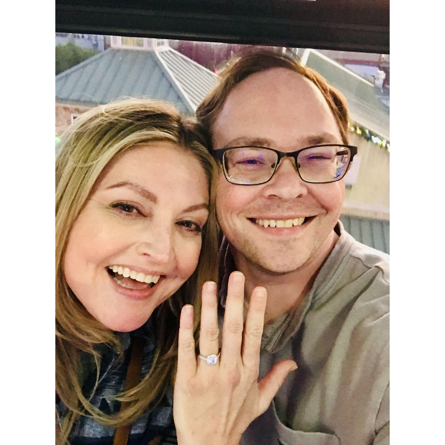 This photo is in Gaitlinburg, TN on a ferris wheel just after Joe proposed to Laura. Joe said he was happy she said yes b/c the ferris wheel still had to go around 3 more times and that would have been awkward.