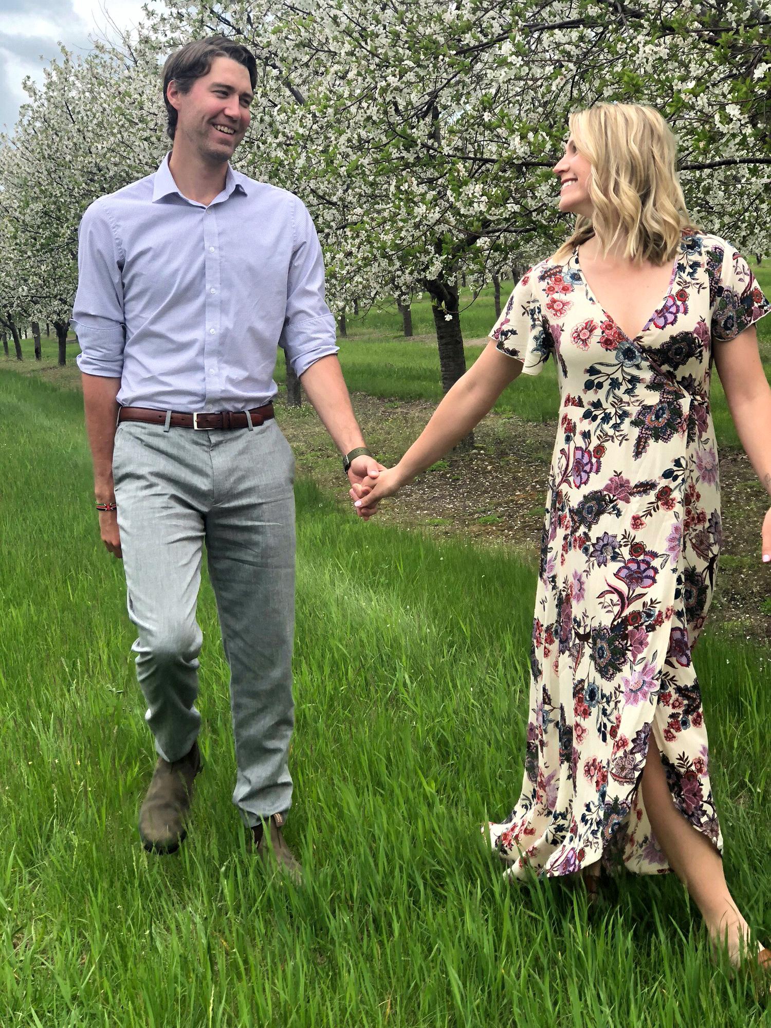 Engaged in Traverse City, MI walking among the cherry blossoms! Photo credit: Devon Burke