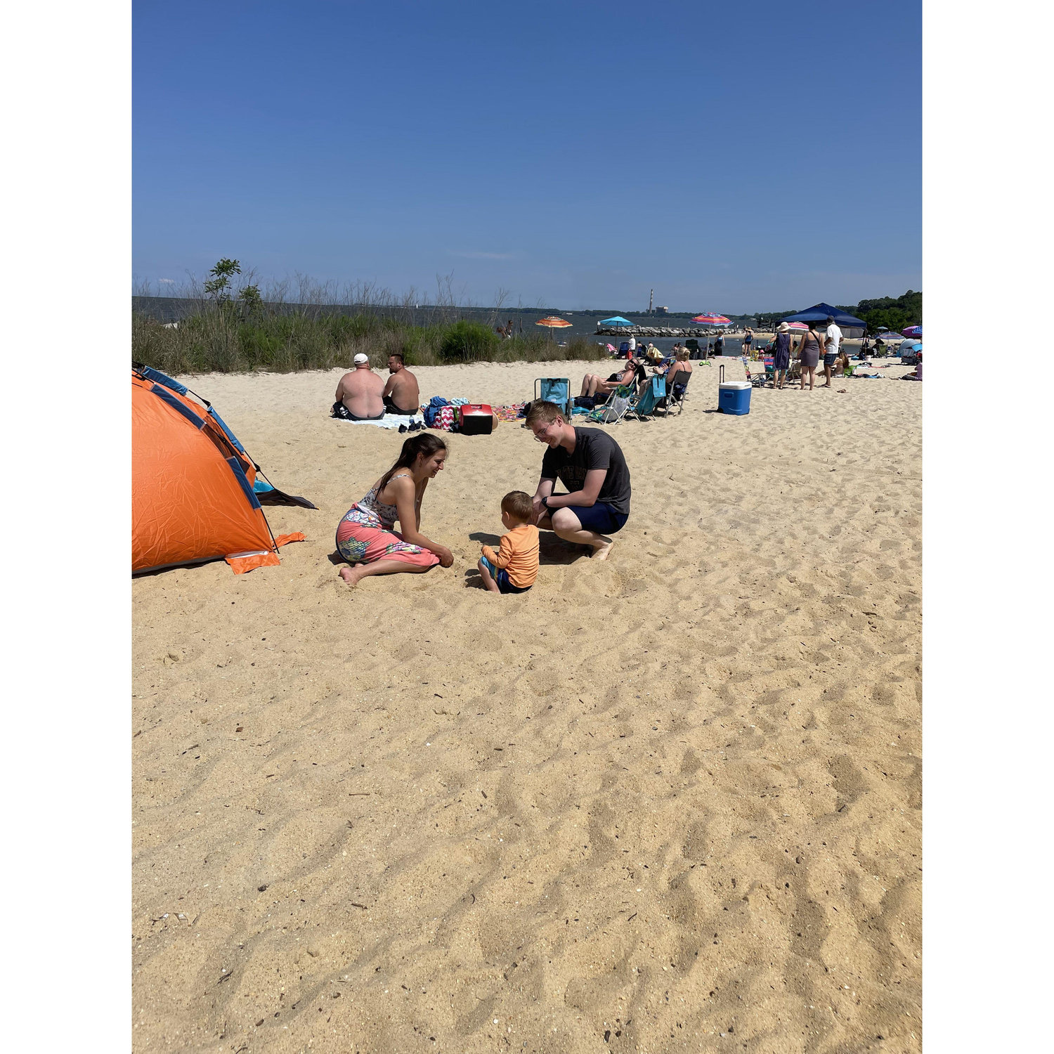 Louie teaching Lizzy and Peter how to make piles of sand