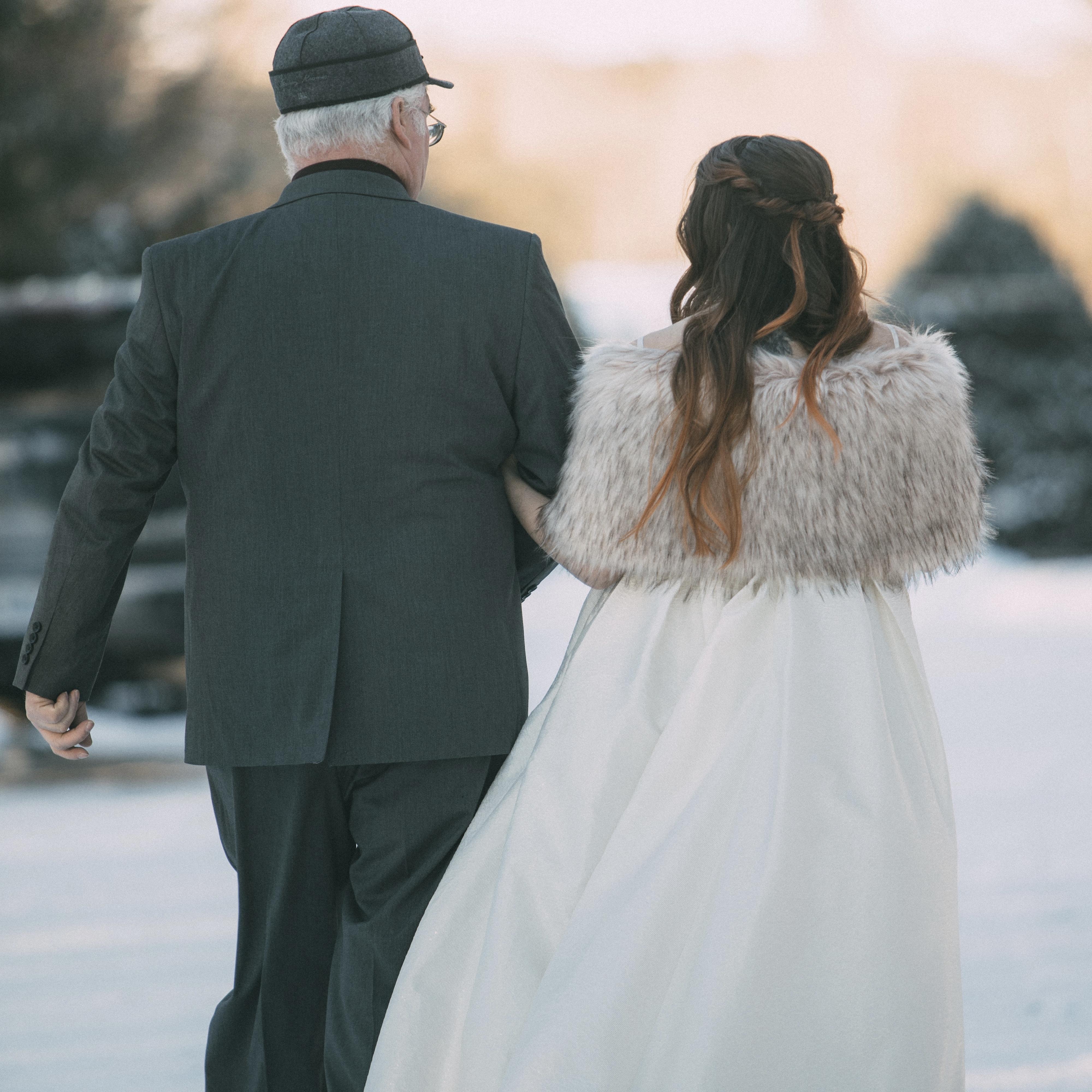 Emily's dad walking her to the ceremony
