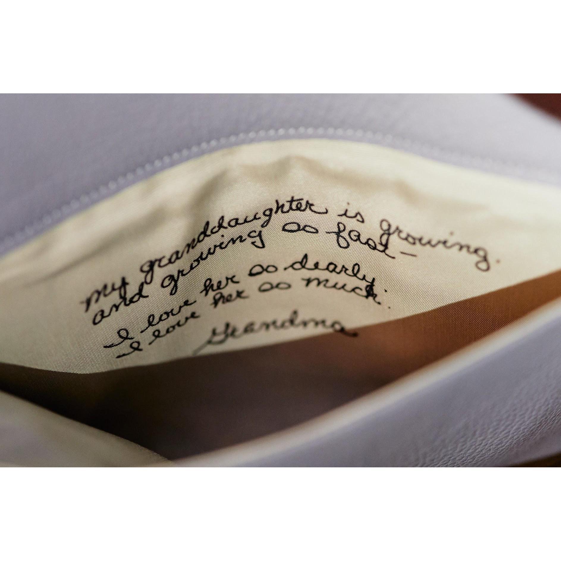 A note from Rachel's late grandmother, printed into a handmade clutch. "My granddaughter is growing and growing so fast--I love her so dearly, I love her so much. Grandma"