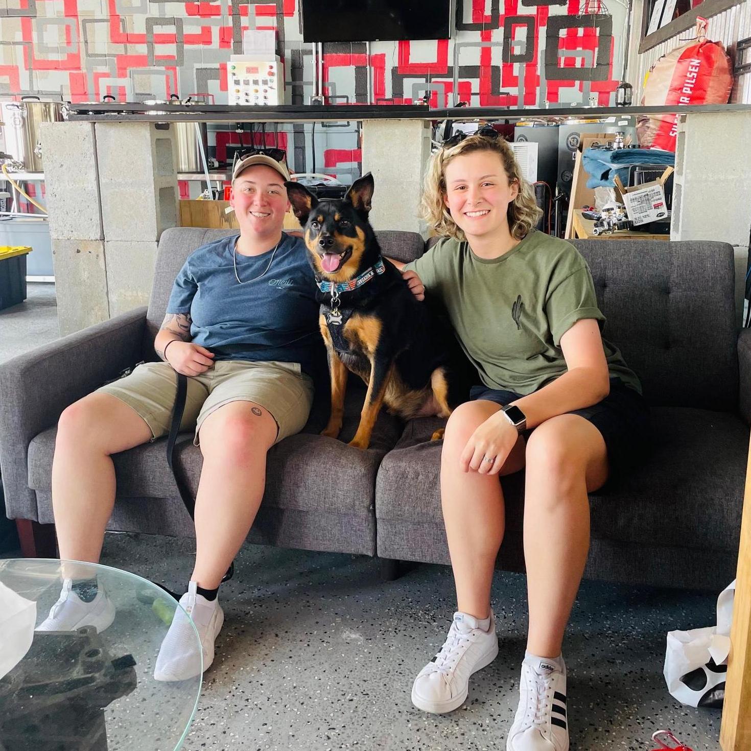 A family photo that was taken at a local bar during a pup-crawl.