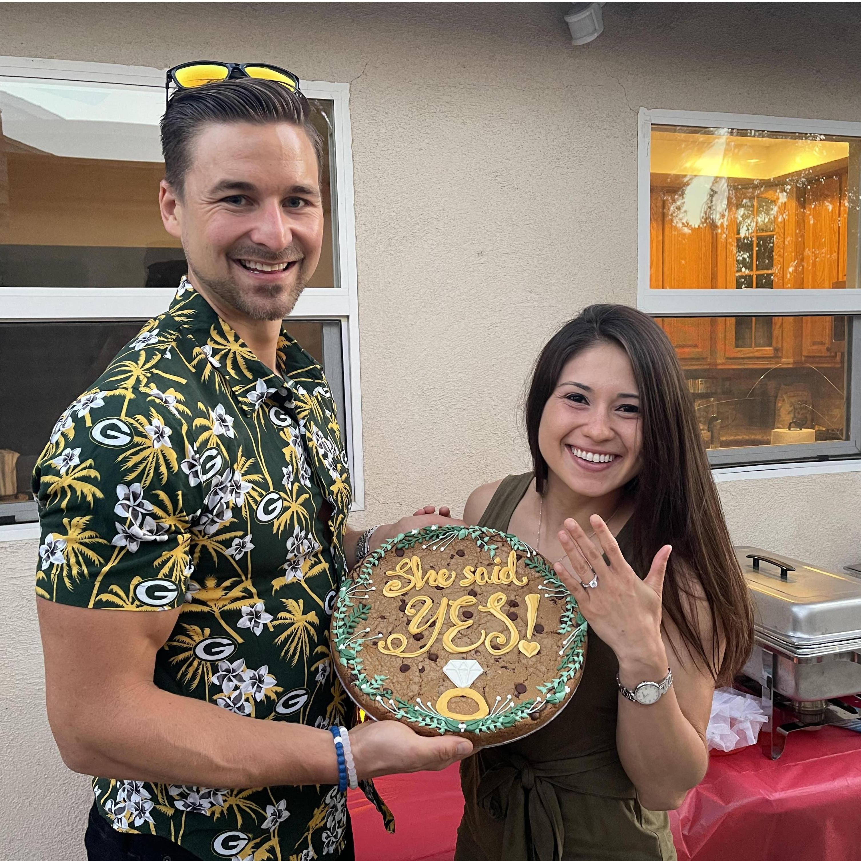 Matching my shirt with our engagement cookie cake.