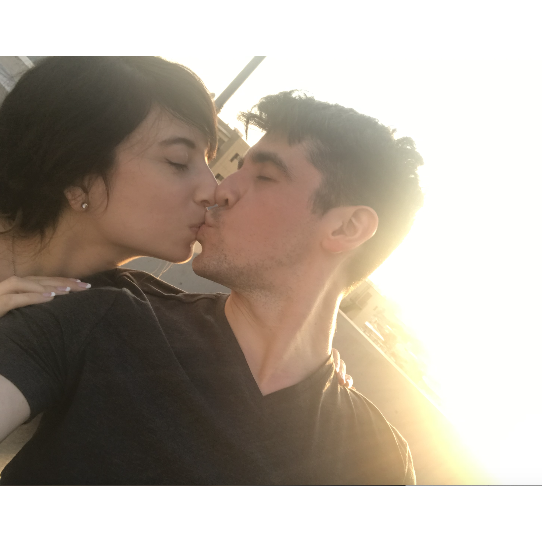 Celebrating just being engaged on a rooftop at sunset in Tokyo