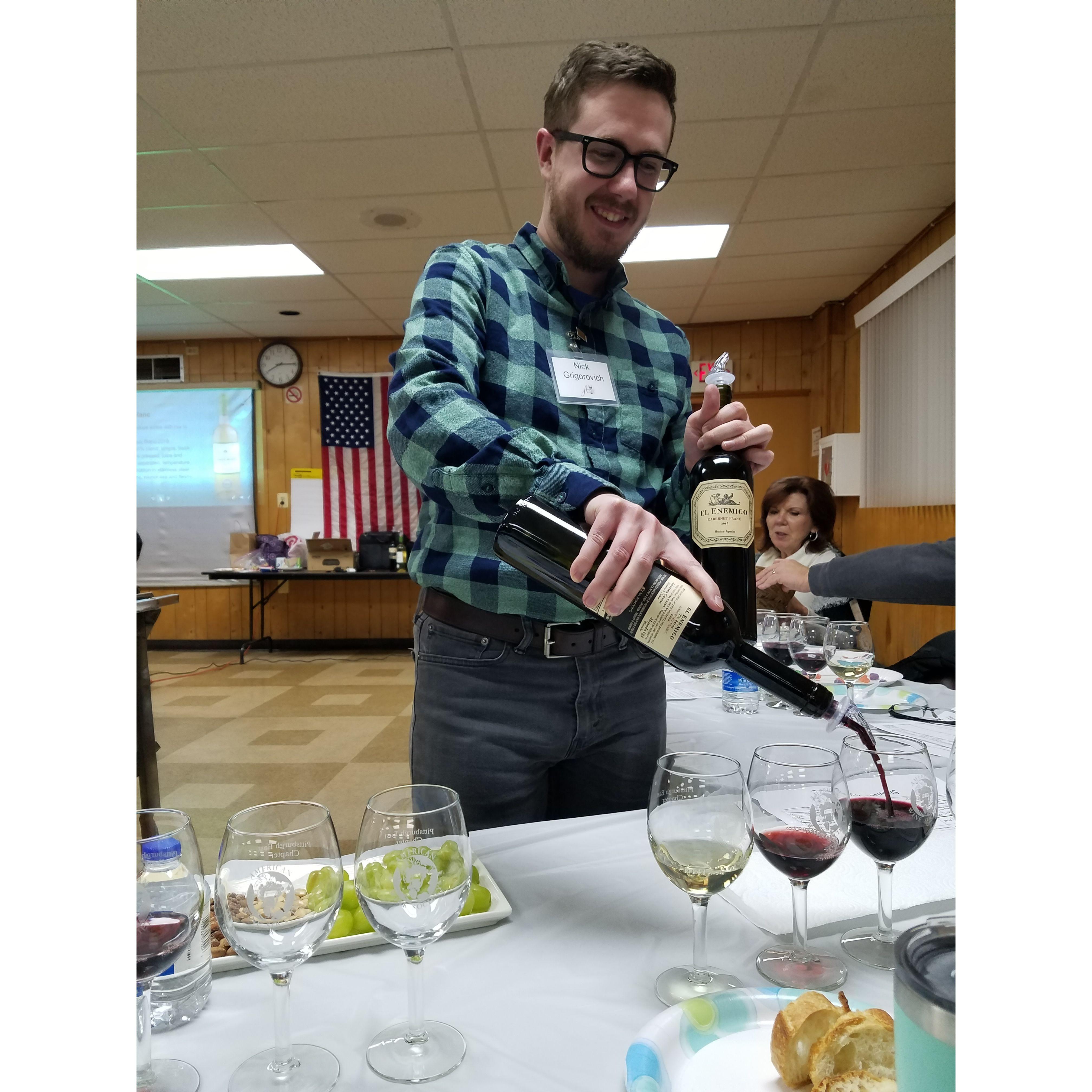 Nick pouring wine at an American Wine Society Meeting