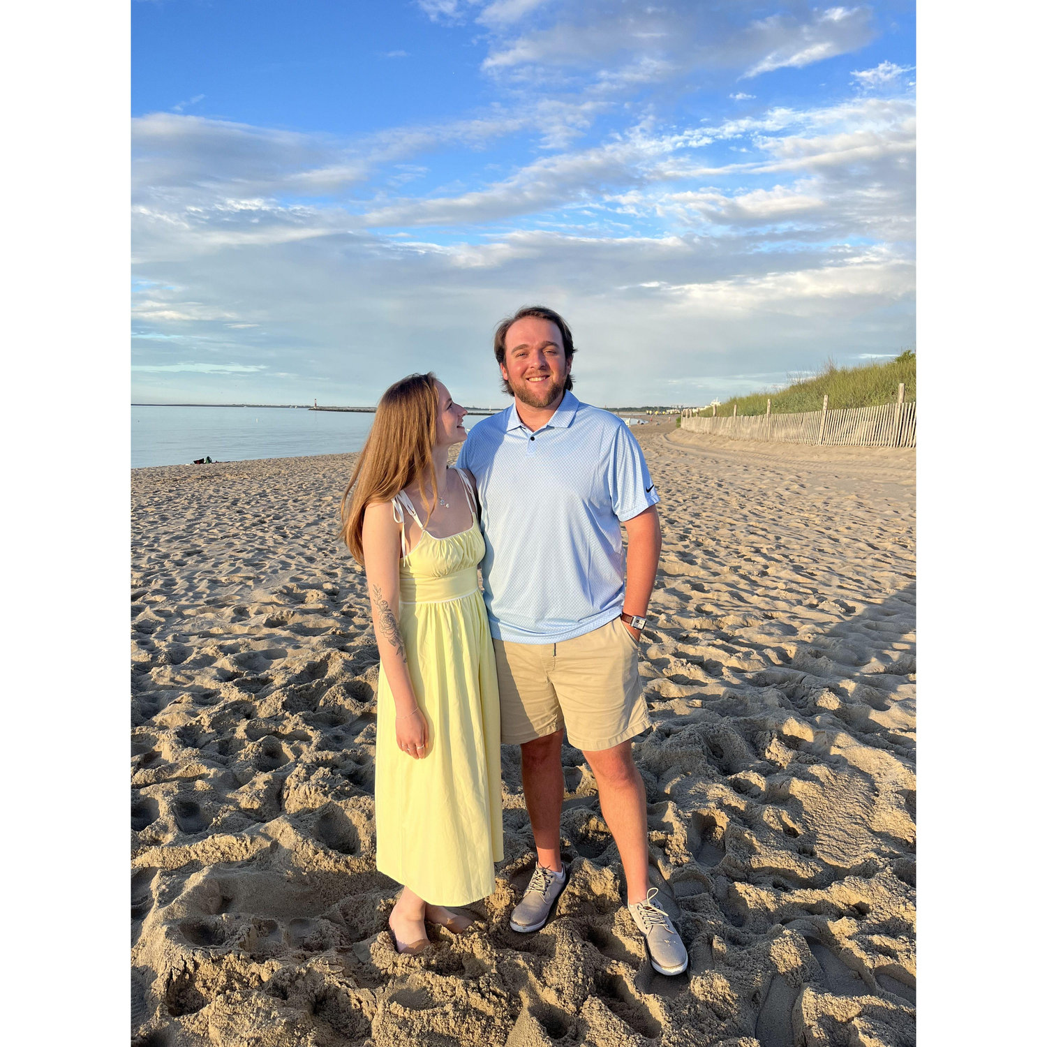 We love going to the beach in Rehoboth every year with family! This was taken a month after our engagement.