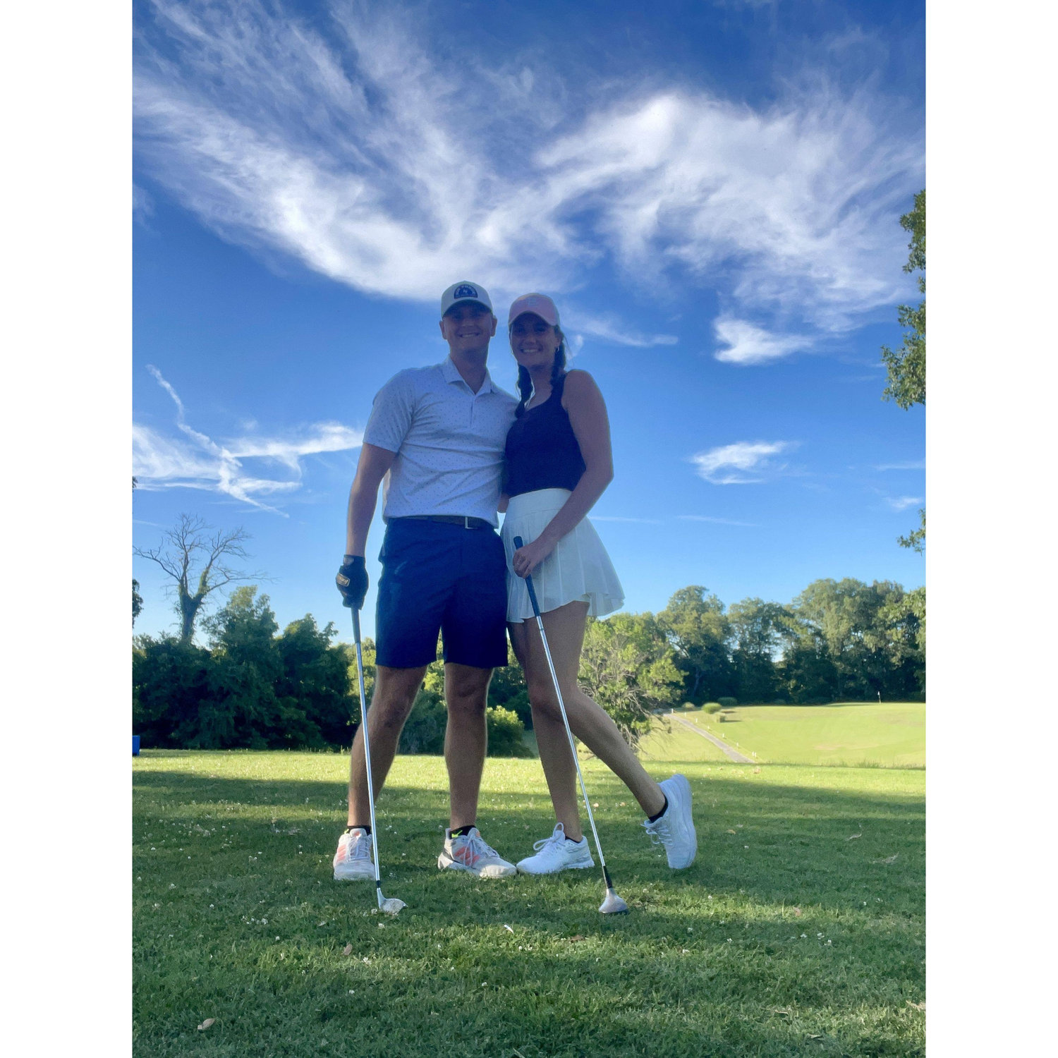 Luke is trying to teach Megan how to golf but Megan is usually better at relaxing in the golf cart :)