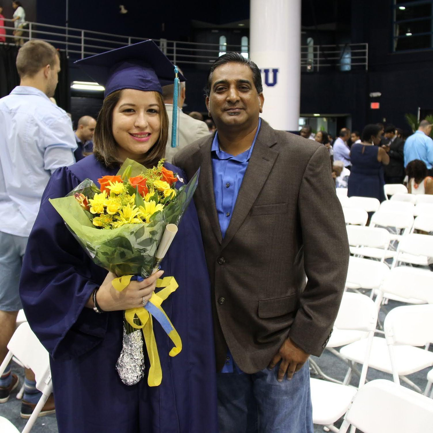 Rudy cheering on Maritza as she graduated with her Bachelor’s degree from FIU, August 7, 2016.
