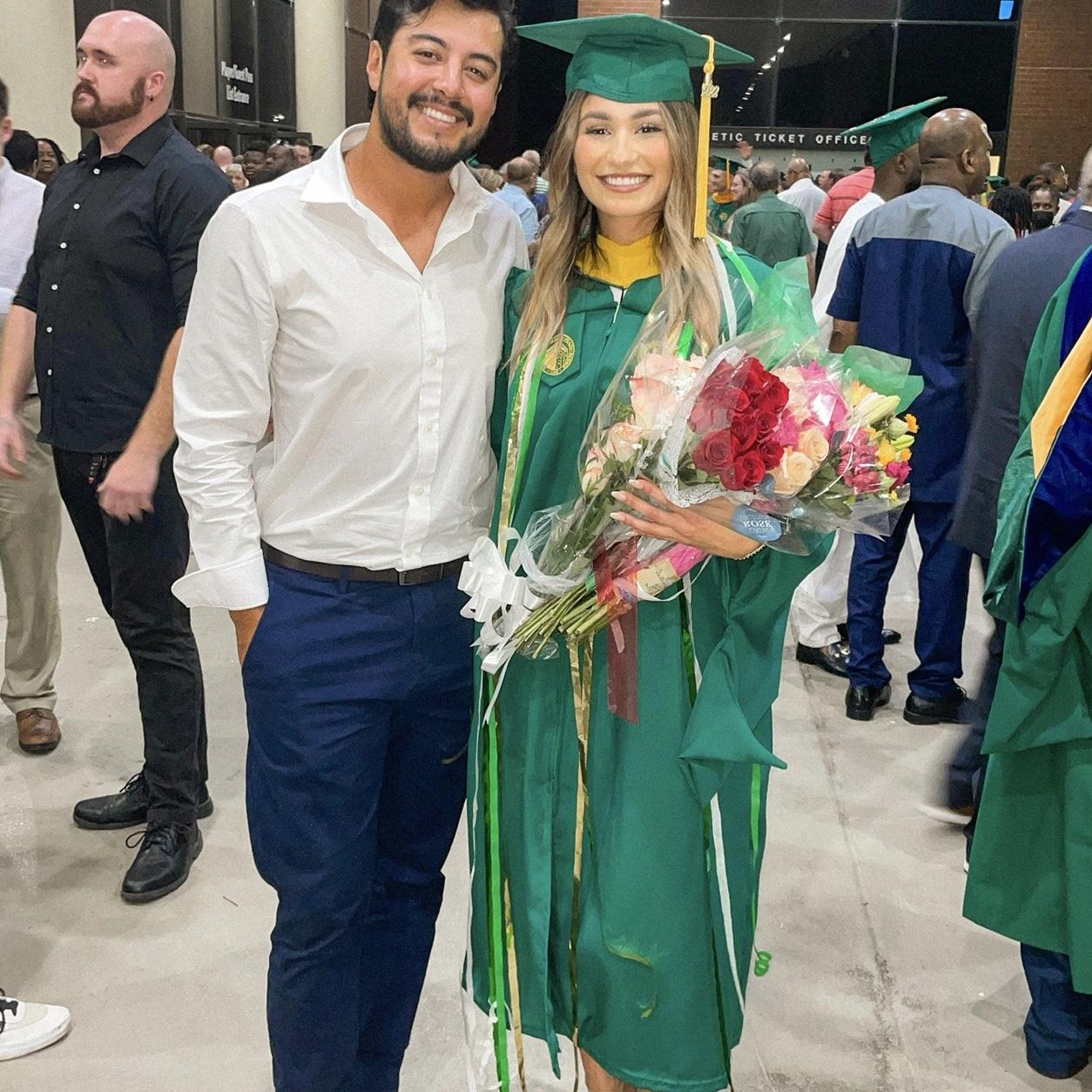 Supporting me at my graduation from UAB Grad school 💚💛