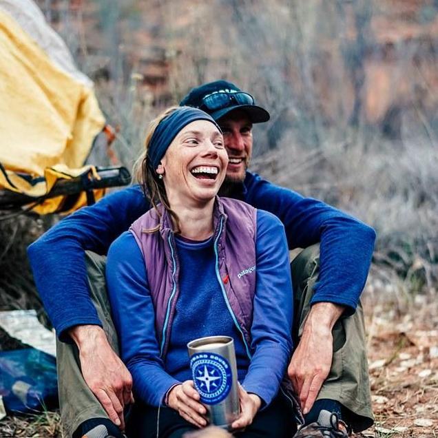 Celebrating our engagement with surprise champagne at camp