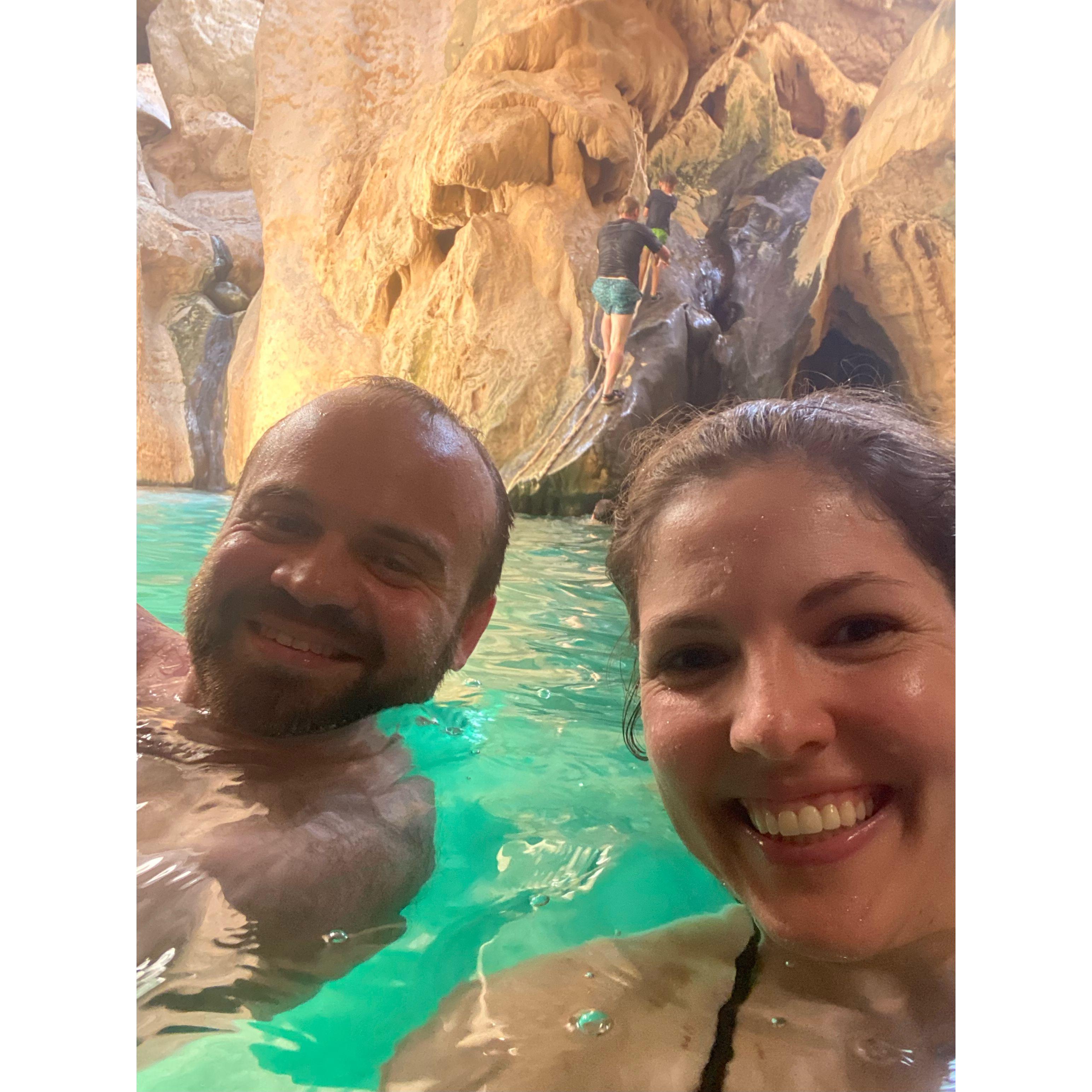 Swimming through a cave in Wadi Shab (Oman)