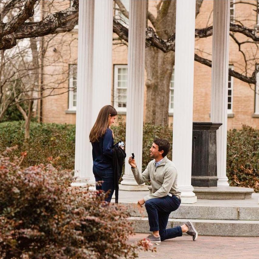 Mark proposing in front of the UNC Old Well (2021)