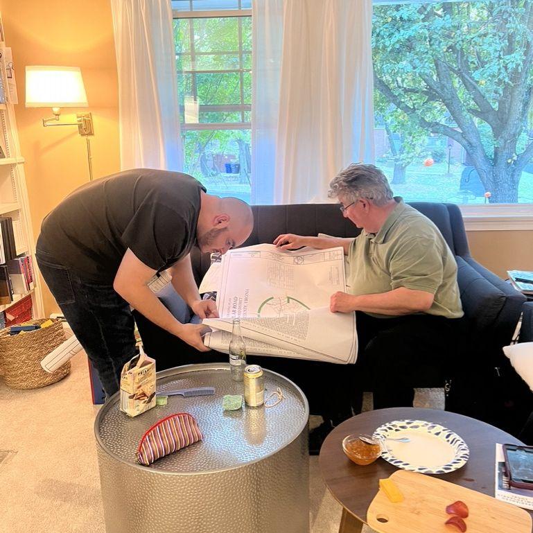Jorge showing Bob his site plans when they first met