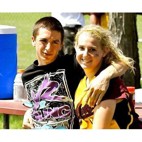 Cam supporting Sara at her softball tournament in 2011.