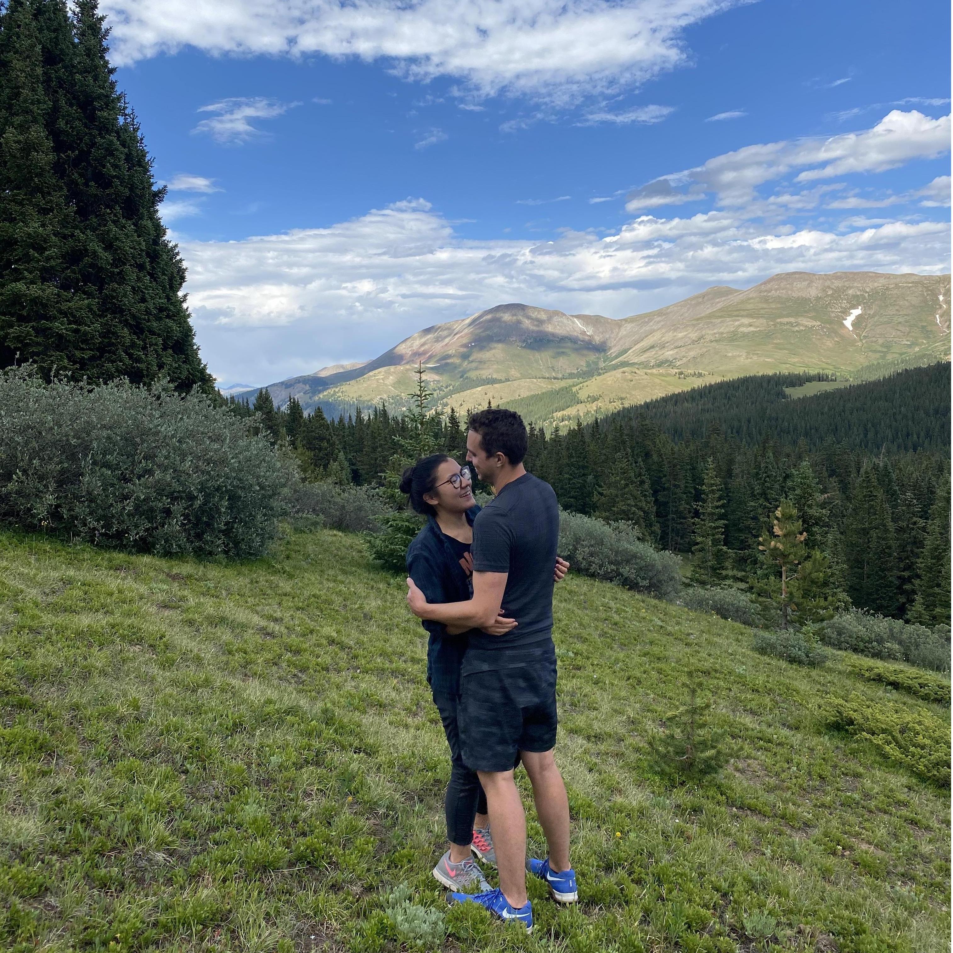 hugging in a field