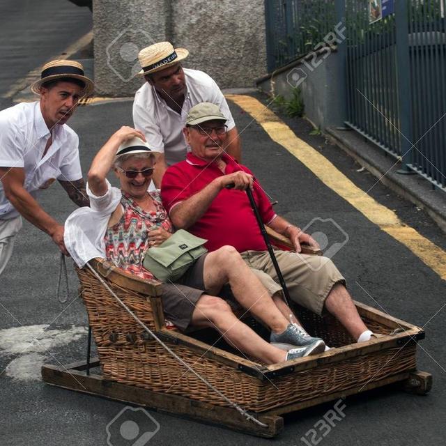 Buy us a wicker basket toboggan ride in Madeira