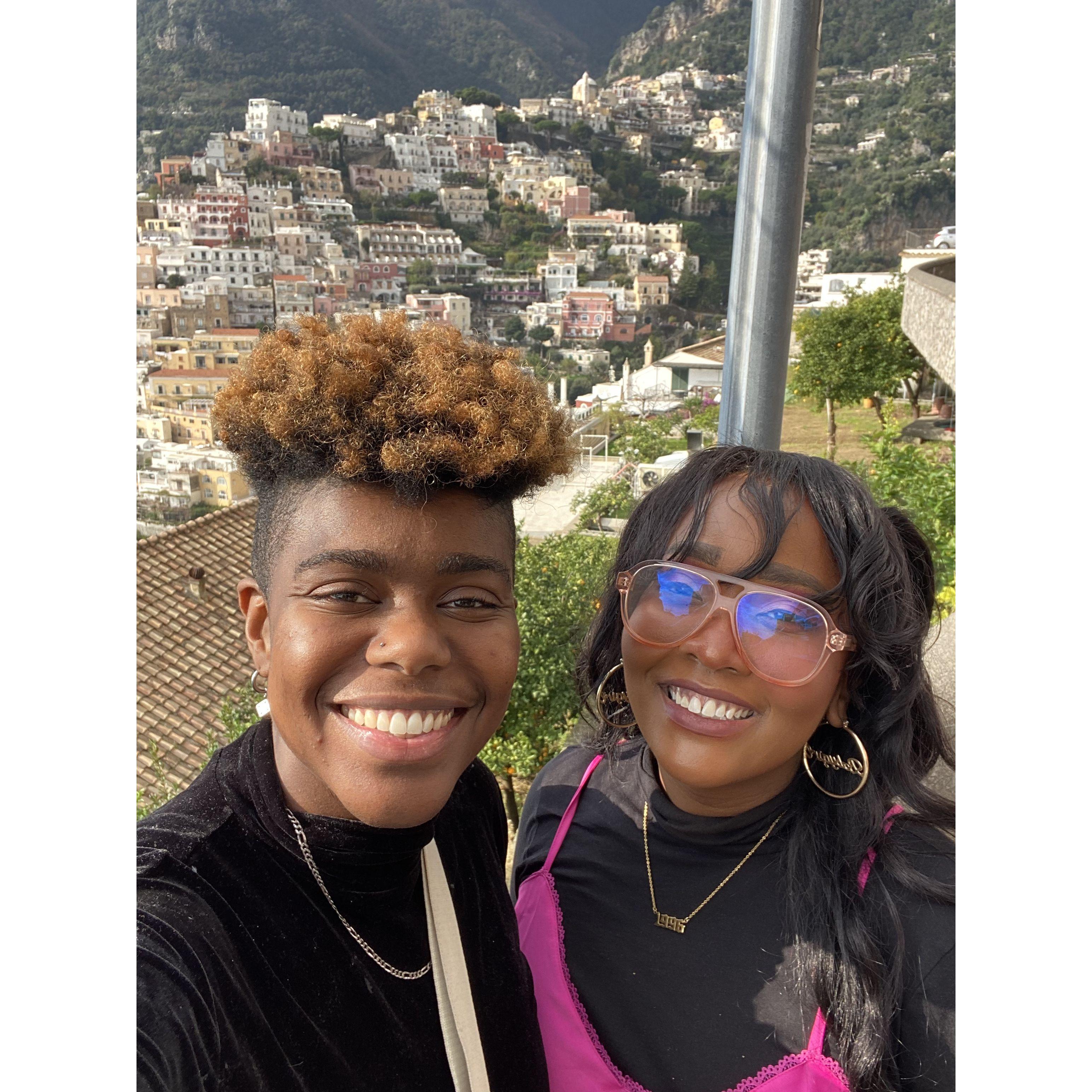 Us with the beautiful city of Positano, Italy.
