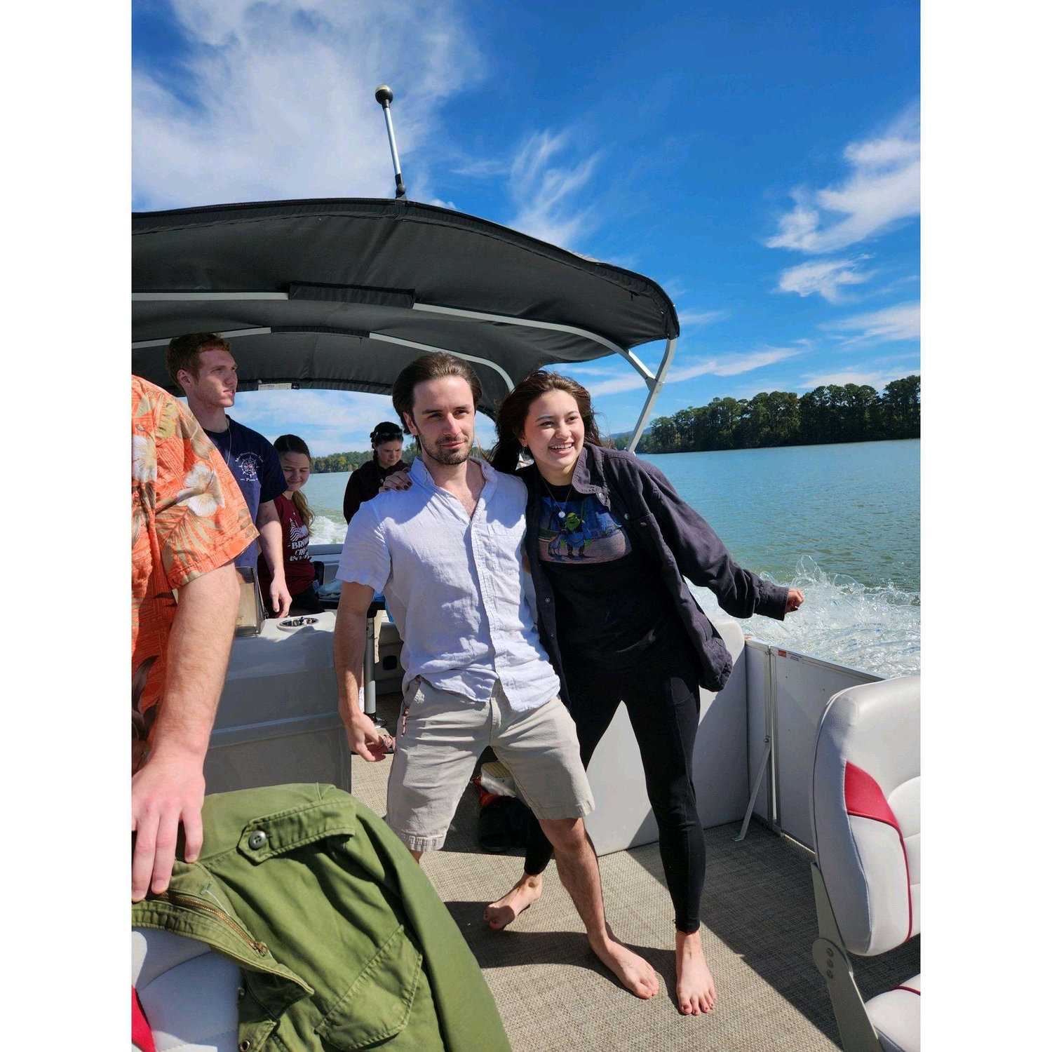 Zach and Madeline boating with friends