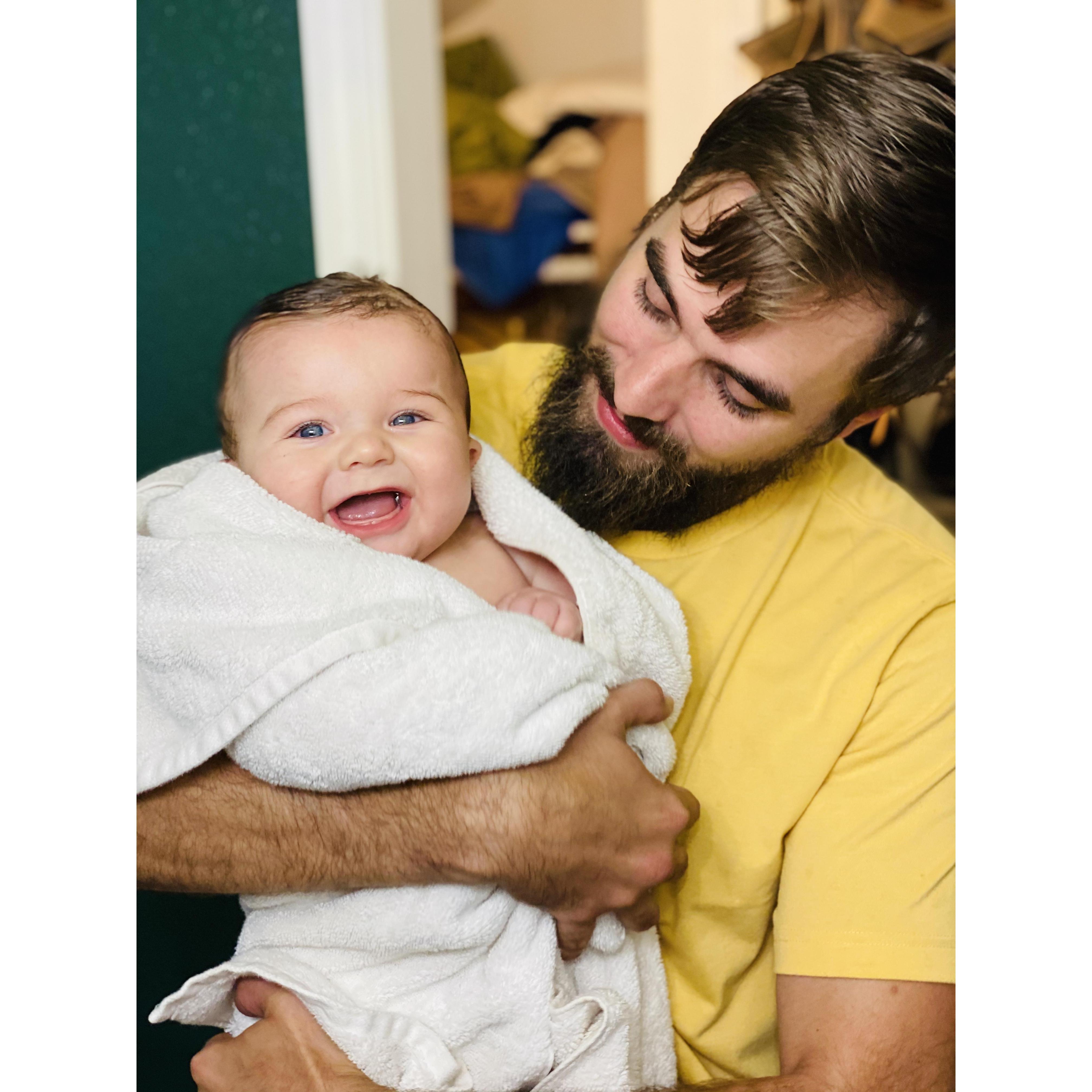 daddy cuddles and big smiles after a nice bath