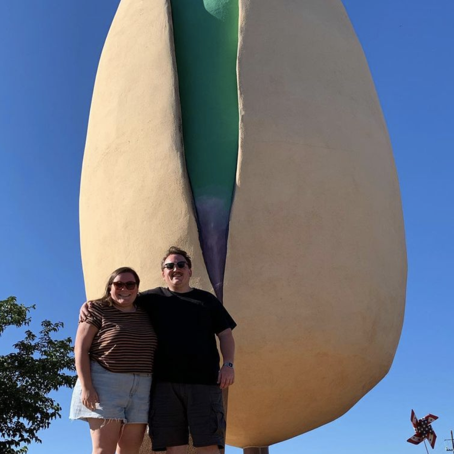 In front of the WORLD'S LARGEST PISTACHIO in Alamogordo, NM. This was the day before Eric proposed!