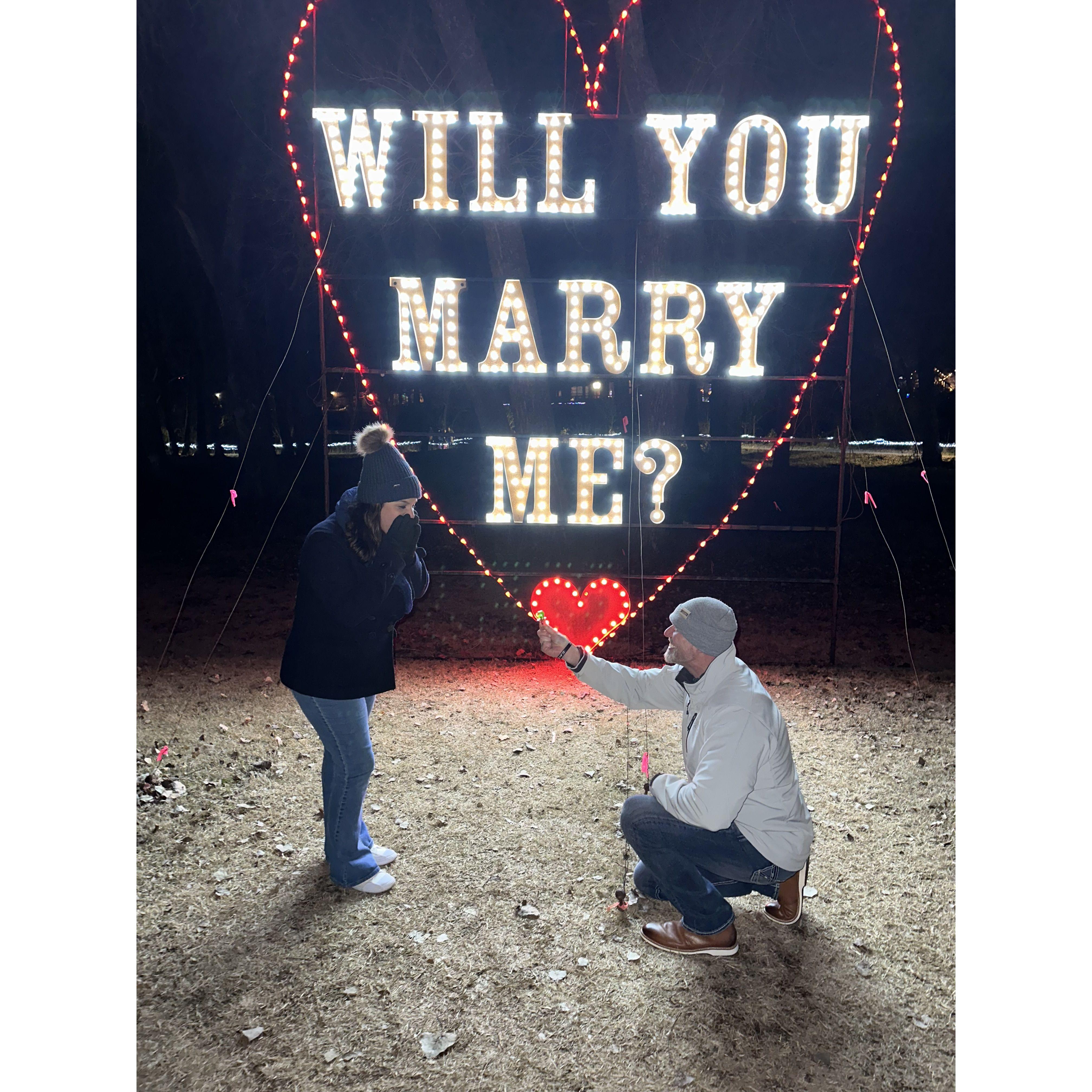 Paul always joked that he was going to propose to me with ring pop. While walking around the lights we saw this sign. We found a ring pop and decided to play a joke on my mom with a fake proposal. Dec 2022