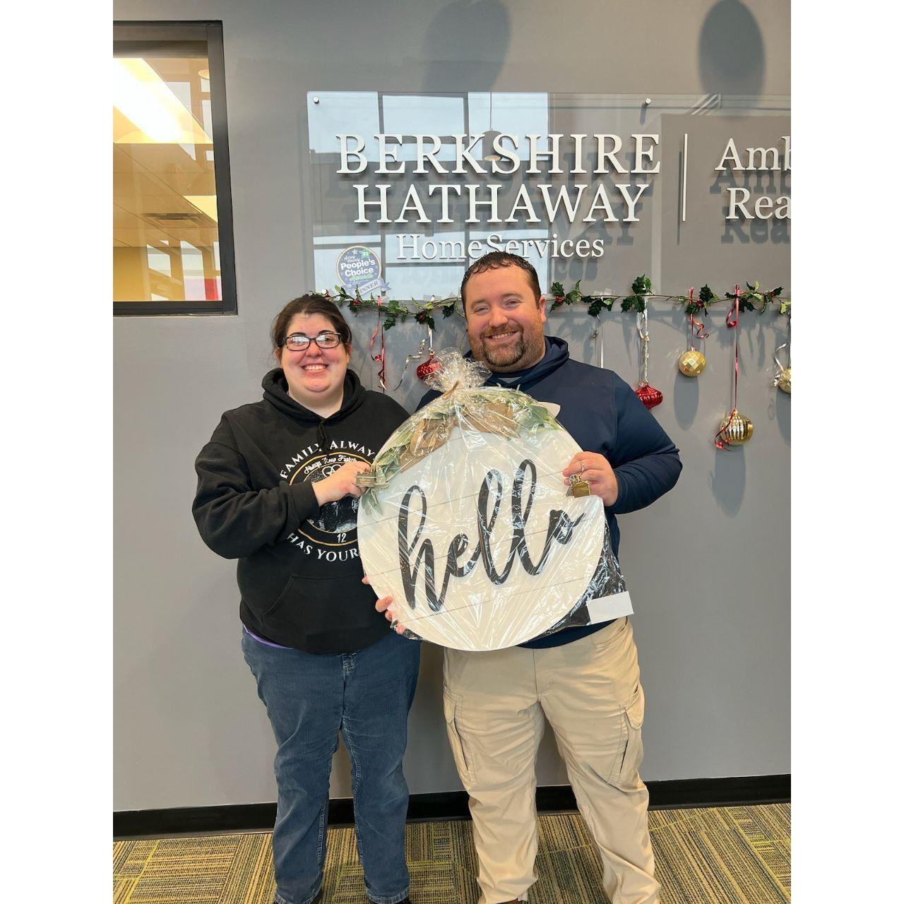 Matthew and Kaitlyn holding a house warming gift!