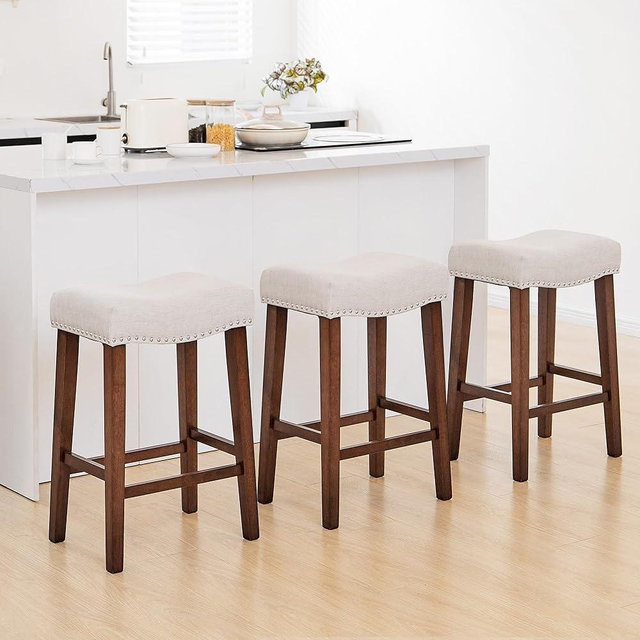 PrimeZone Counter Height Bar Stools Set of 3 - Backless Saddle Barstools with 4.3" Thick Upholstered, Nailhead Trim Linen Fabric & Solid Wood Legs, 24 Inch Counter Stools for Kitchen Island, Beige