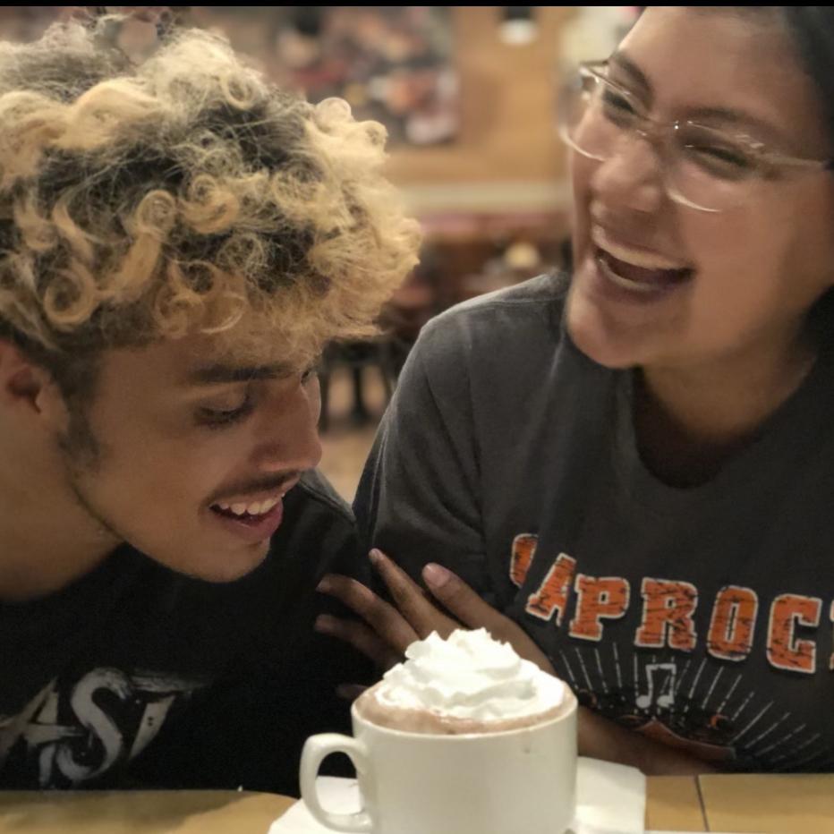Fighting over a hot chocolate after a football game.