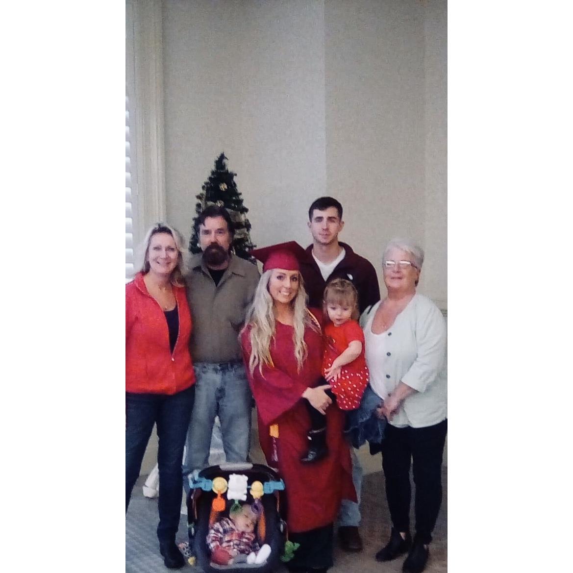 Our first family picture where I am officially a college graduate.