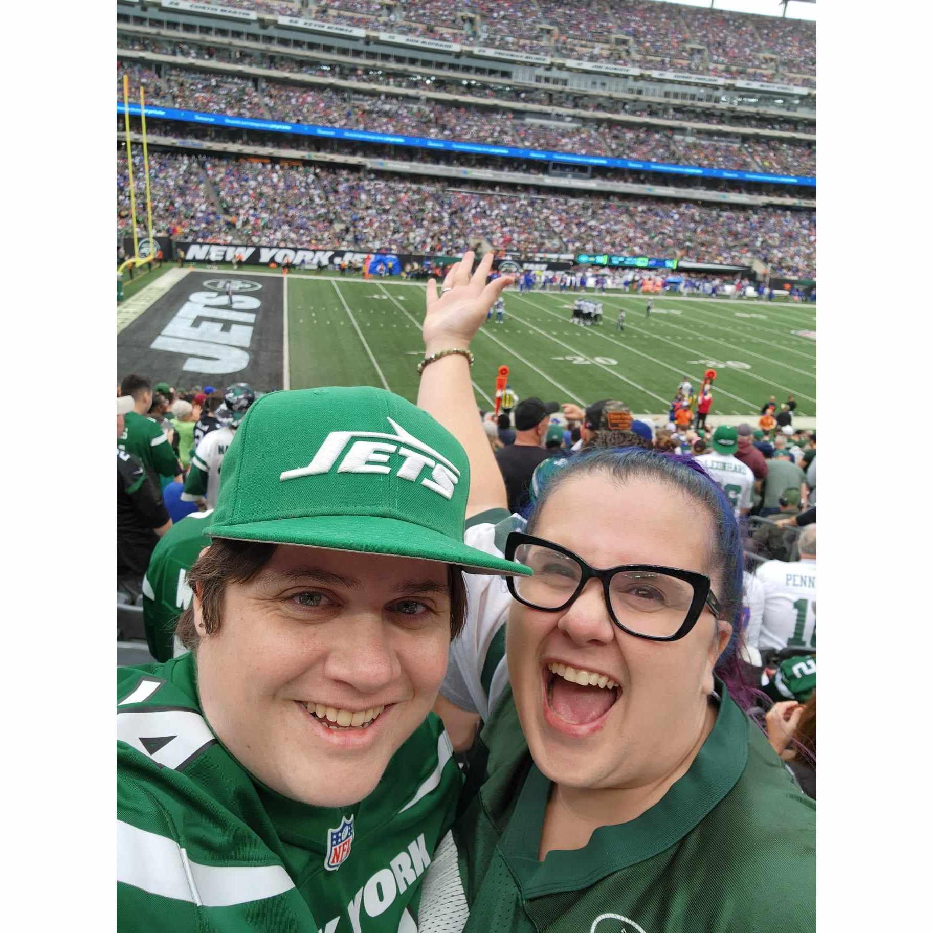 Cheering on our underdog green team with some awesome seats at a Jets game