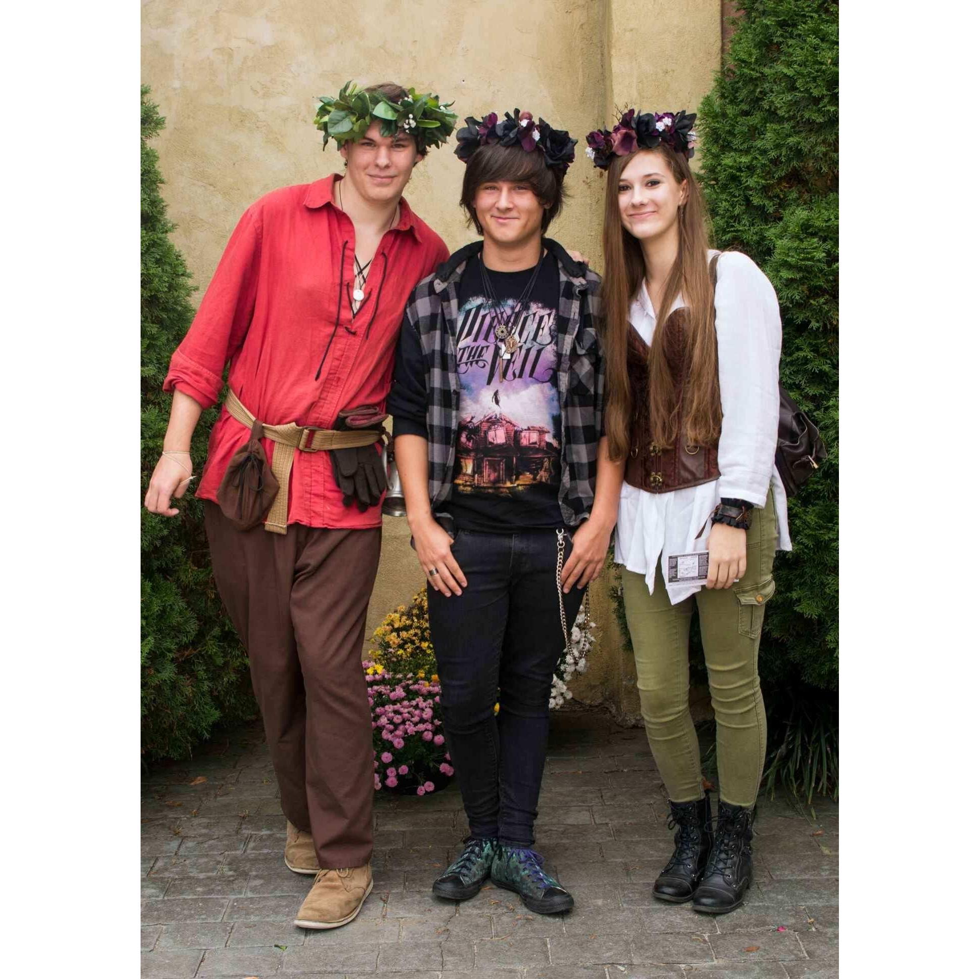 This was taken at the Ren Faire roughly six months into our relationship. We have no idea who the guy in red is or if he was even a worker, he just came over and stood by us while we took a picture.
