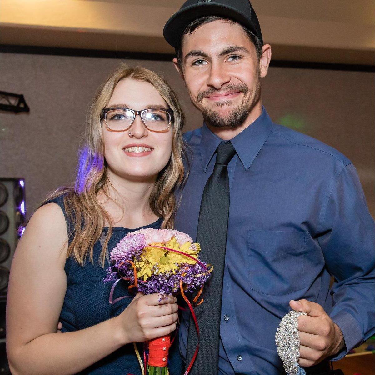 A picture of us at my brothers wedding, I caught the bouquet and Bayley caught the garter!