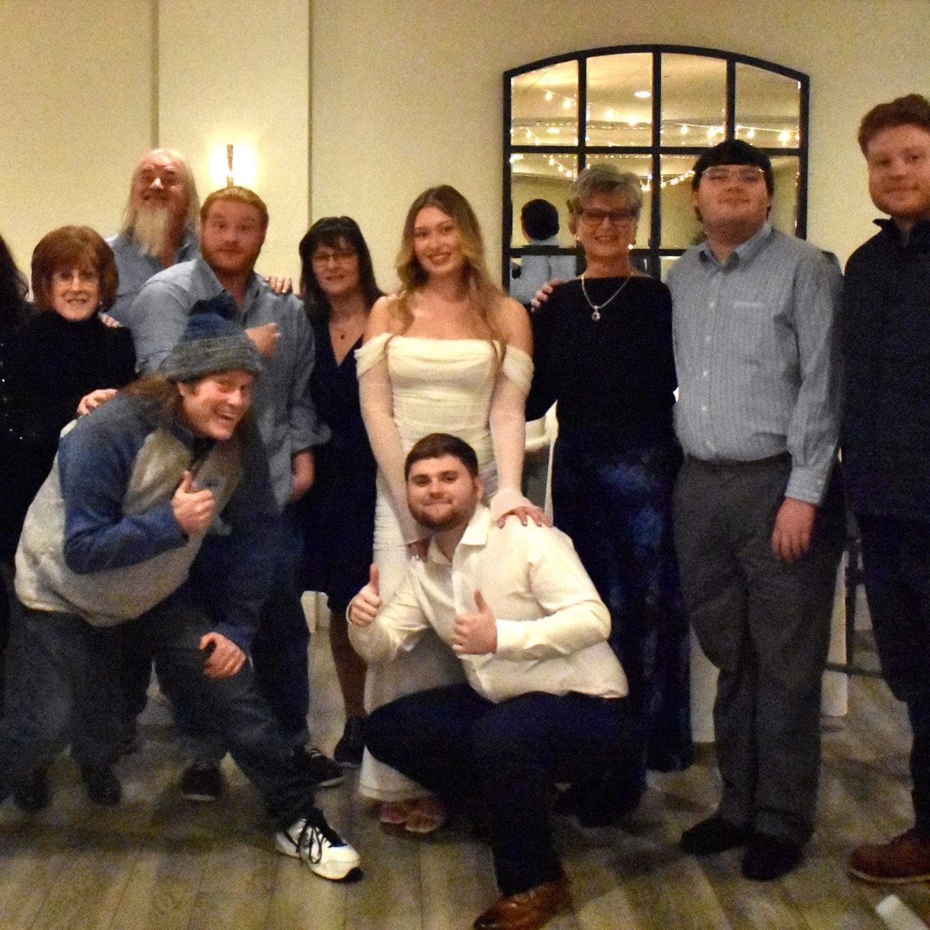 LEFT TO RIGHT: Mabel’s step grandmother Cindy, father Wayne, cousin Tyler, cousin Skip, mother Deb, bride, groom, aunt Cheryl, brother Homer, & cousin Justin