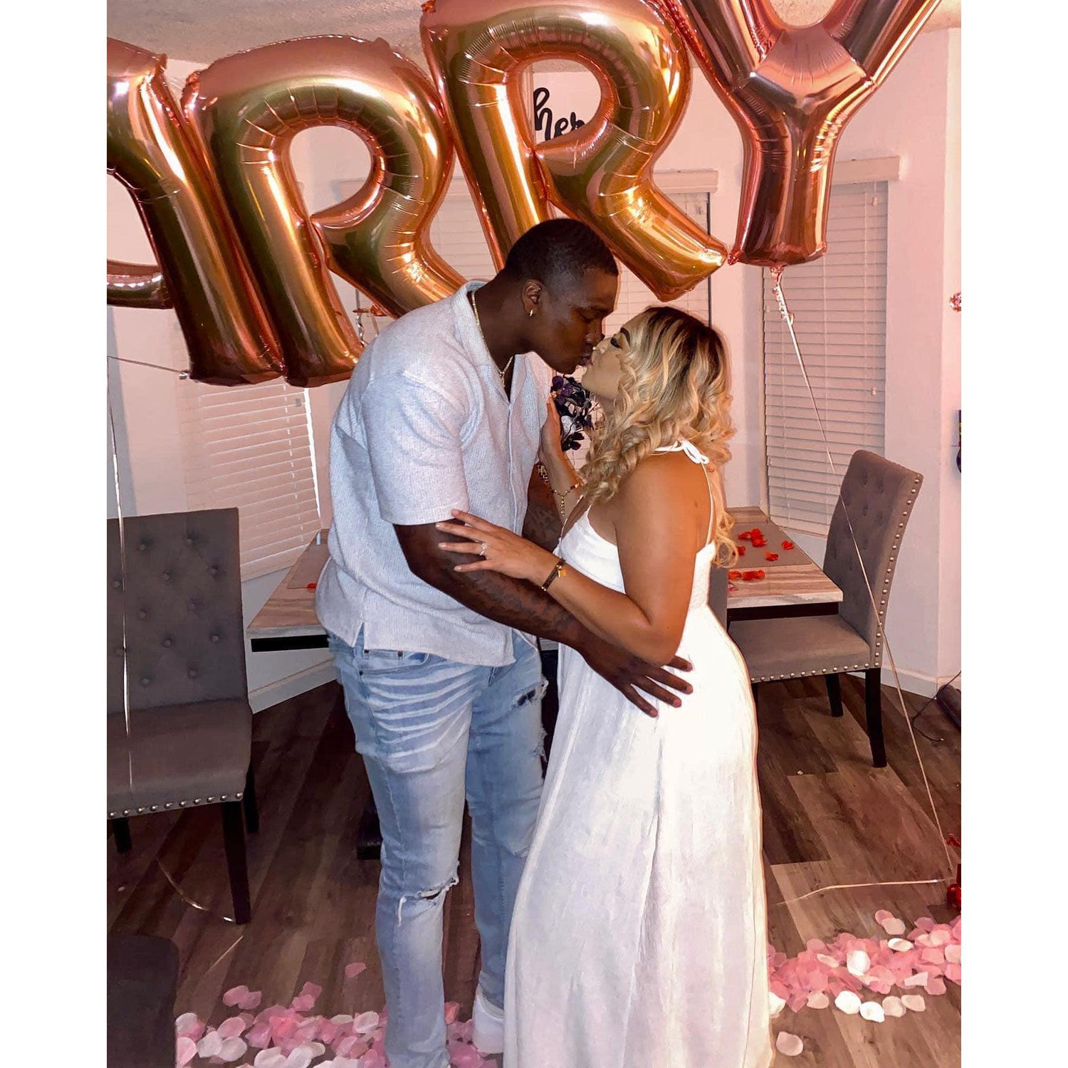 After taking "family photos" I came home to a suprise!! I walked in, balloons and flowers everywhere, I turned around and he was on one knee! I had no ideaaa.... it was a great day! :)
